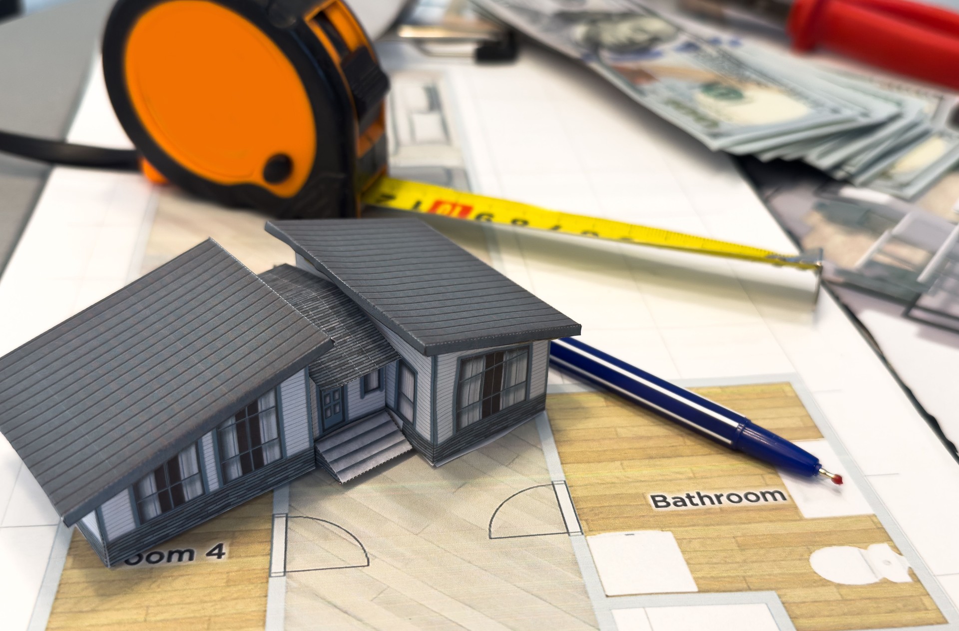 Architectural model on desk , drawing technical tools and blueprints. Architecture, building, construction and real estate business.
